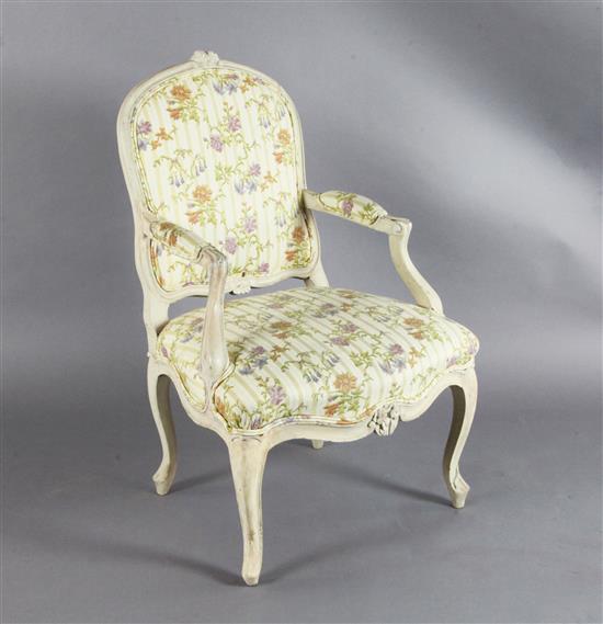 A set of four mid 18th century Louis XV painted fauteuils,